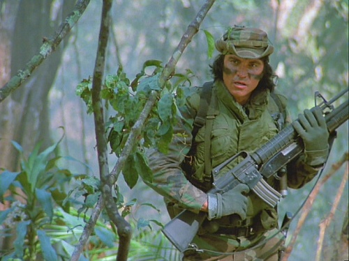 Predator movie Billy showing two guns together and SPI attached to a Moss 500 shotgun