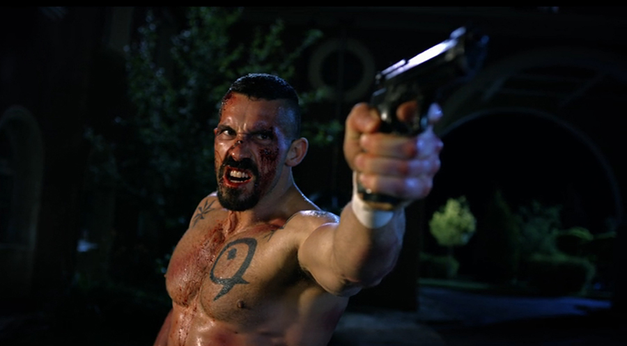 Scott Adkins as Boyka with a gun in Boyka: Undisputed