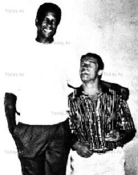 Kevin Peter Hall and Arnold Schwarzenegger