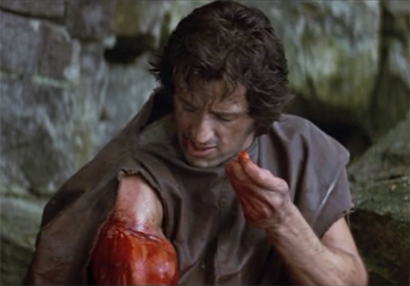 Rambo dresses his own wound in First Blood, a Rambo trademark