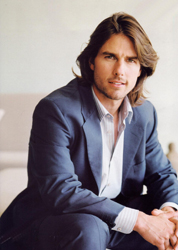 Tom Cruise with long hair in a blue suit