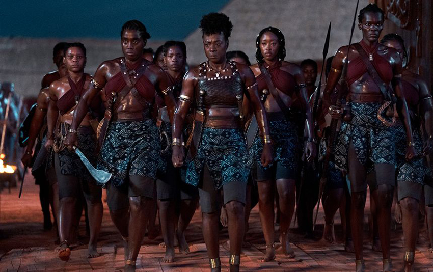 The Woman King movie featuring the Agojie warriors in uniform, and armed for battle