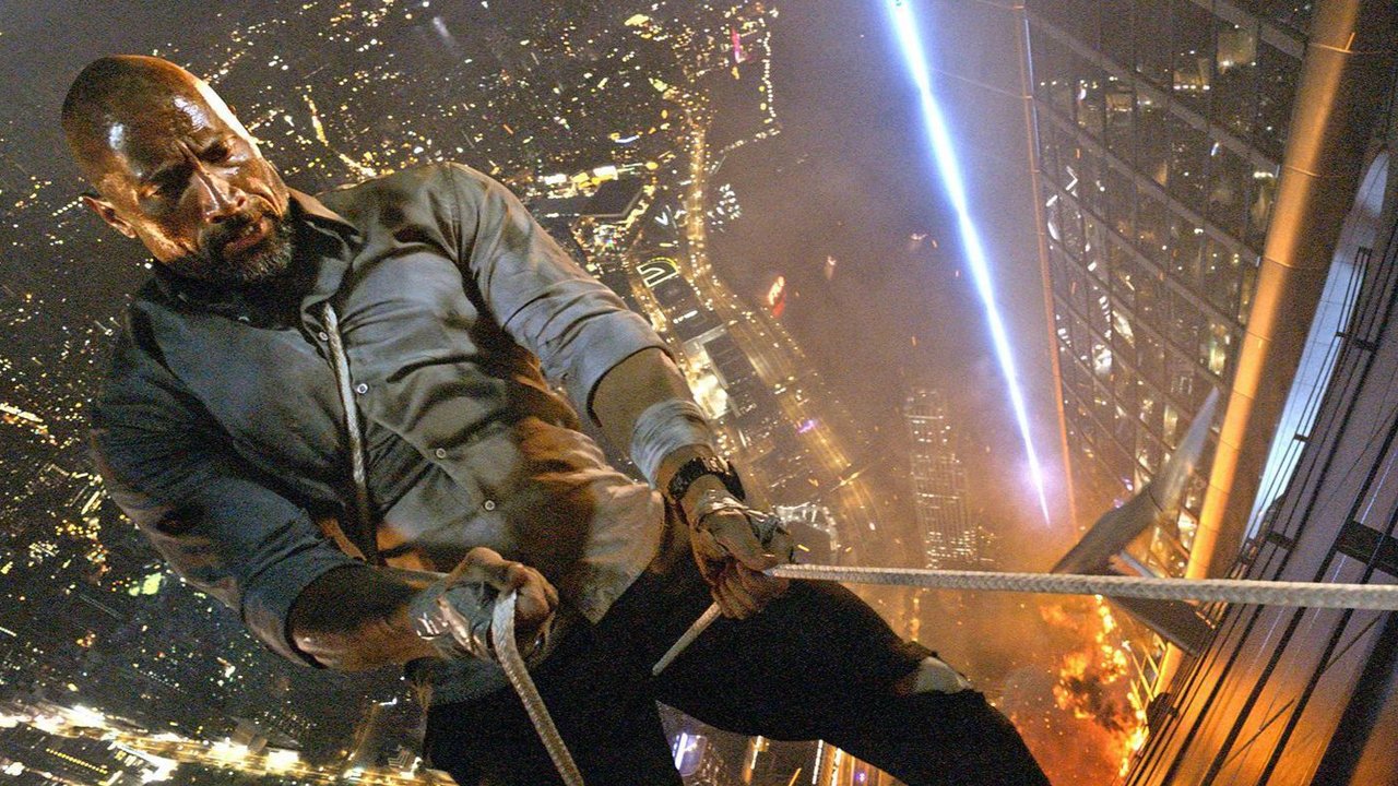 Dwayne Johnson repels down the side of the Pearl highrise in Skyscraper