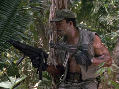 Predator movie Dillon with two guns at the ready