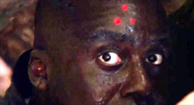 Predator movie Mac with the three-red-dots Predator target on his forehead